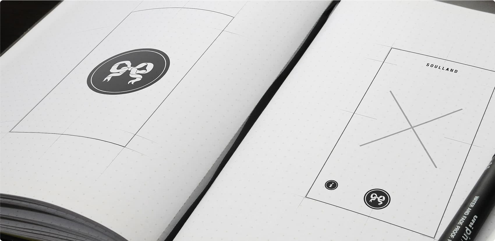 Soulland — early mobile UI sketches in notebook