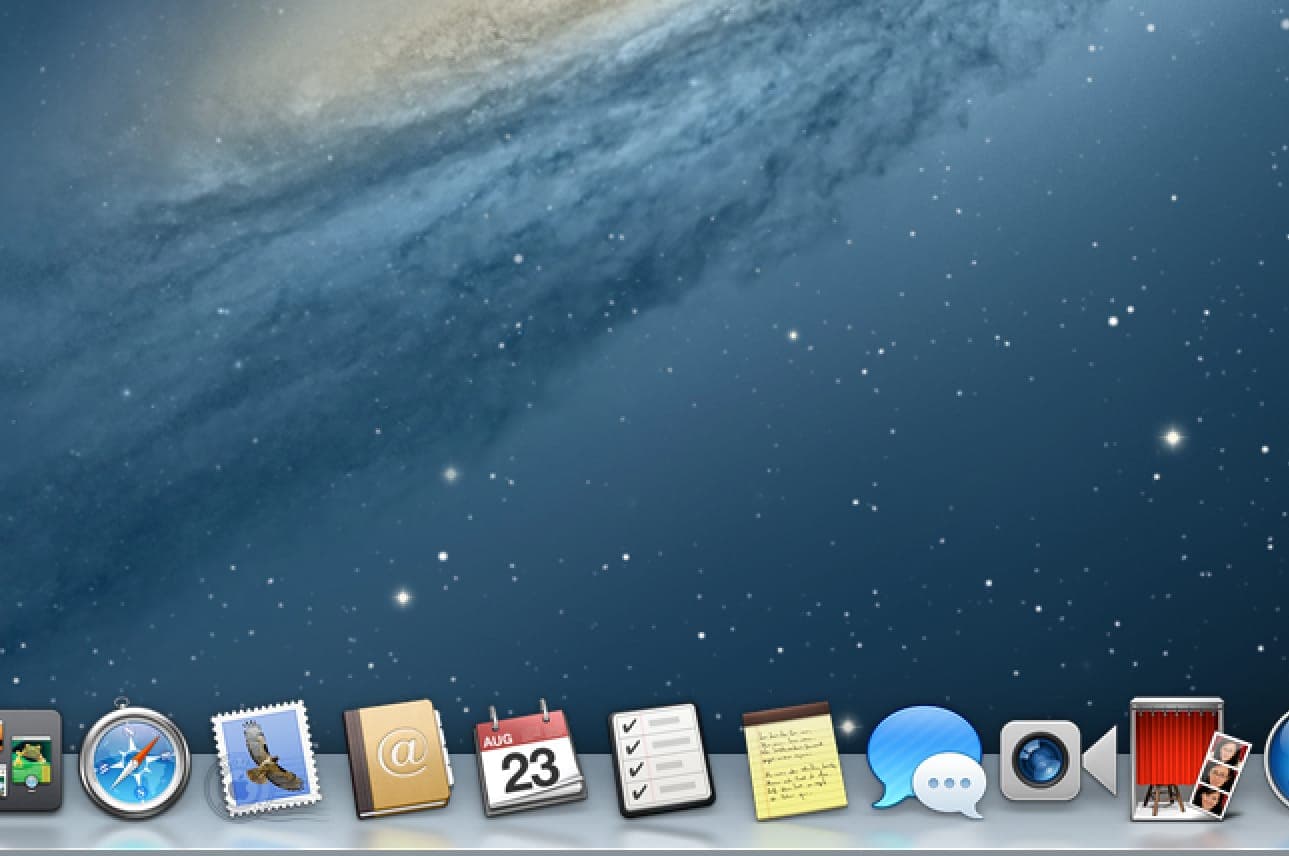 macOS Mountain Lion dock: skeuomorphic app icons on a reflective glass shelf over the Galaxy starfield wallpaper—System Preferences, Safari, Mail, Contacts, Calendar, and more
